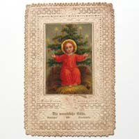 Christkind in der Krippe mit Weihnachtsbaum