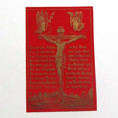 Goldenes Kruzifix auf rotem Cellophan, Andachtsbildchen